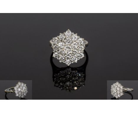 18ct White Gold Fine Diamond Cluster Ring. Flowerhead setting. Comprises of 19 Brilliant Cut Diamonds. Est 15 points each. To