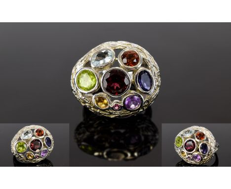 Multi Gemstone Ring, bezel set round and oval cut gemstones including garnet, amethyst, peridot, fire opal, iolite etc. set a