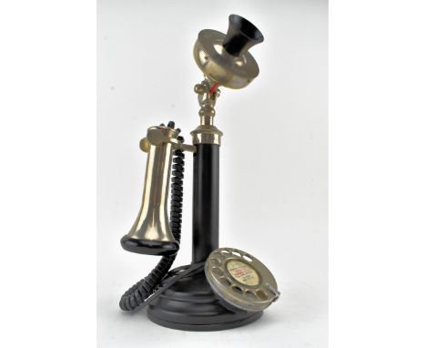 A heavy early 20th century 1920's metal candlestick telephone. The telephone of black metal compostion. Fitted for a modern f