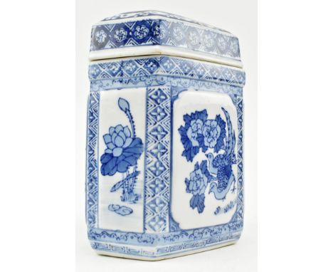 A Chinese 20th century hallmarked blue &amp; white ceramic tea caddy. The caddy decorated with floral &amp; fauna cartouches 