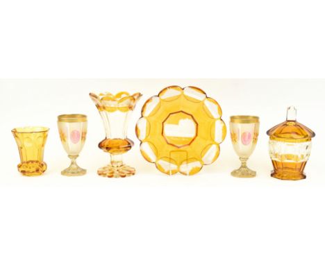 A collection of 20th century Bohemian cut glass items. The lot including a set comprising of dish, vase, goblet and lidded bo