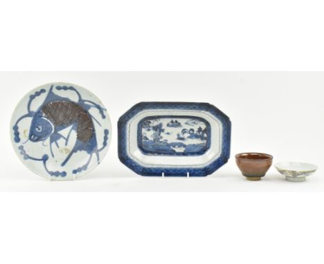 A collection of four Chinese 19th century ceramic pieces. The lot to include a Qing dynasty blue and white ceramic charger, a
