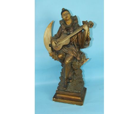 An Art-Nouveau-style plaster figure of Pierrot seated on a moon, playing the mandolin, 63cm high.
