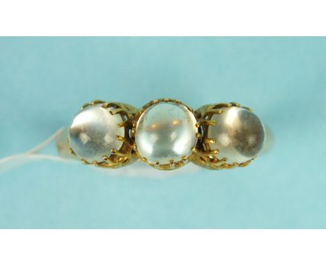 A Victorian moonstone ring claw set three round moonstones in 18ct gold mount, size O 1/2, 3.6g.