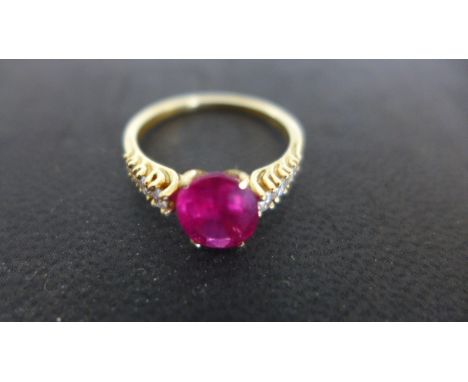 An 18ct yellow gold ruby and diamond ring size Q - approx weight 3.2 grams - some light surface scratches