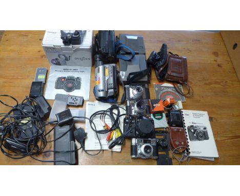 A selection of cameras and photo accessories to include two working Polaroid image system instant print cameras, a Braun colo