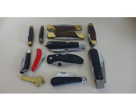 A collection of 12 pocket penknives to include a horse grooming knife with various tools and rescue knife