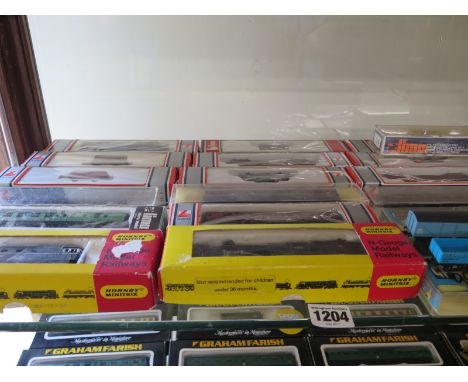 Fourteen N gauge locomotives, various makes including Hornby Minitrix, Lima, approx forty carriages including passenger and f