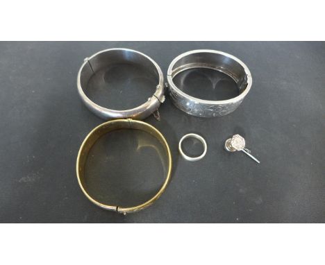 Two silver bangles, a rolled gold bangle, solid silver shirt stud and a silver ring size N