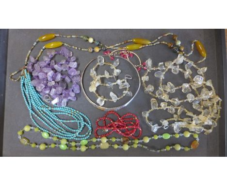 A seven day jade necklace 110cm long, an amethyst necklace, a turquoise necklace, three other necklaces, a bangle and a silve