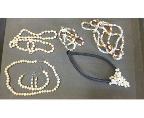 Three pearl necklaces, a pearl bangle, a pair of earrings and two breacelets
