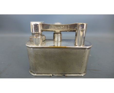 A Dunhill chrome plated table lighter - chrome plate loss to base and top, in good mechanical order 8cm wide