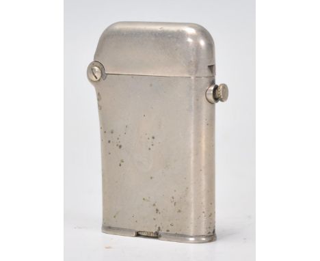 A vintage early 20th Century Thorens Swiss made lighter. Stamped to base Brit. PAT January 29.1920. No. 137,508. Measures 6cm