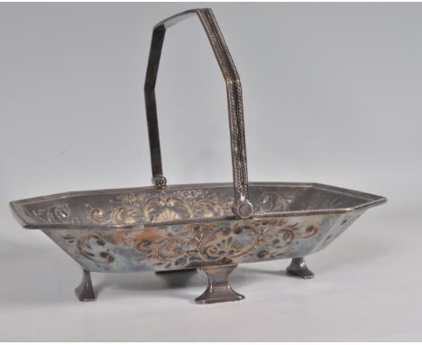An antique silver plated basket of chamfered rectangular form having repousse decoration with an oval engraved panel to the c