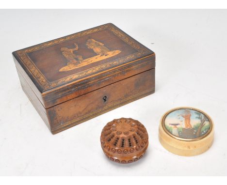 A group of three 20th Century items to include a coquilla nut pomander case being carved with concentric circle patterning wi