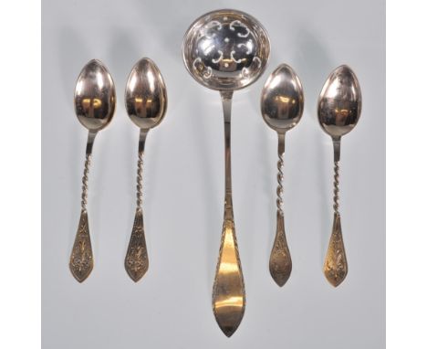 A selection of stamped 830 Norwegian silver tea spoons having twist design handles with engraved floral design handles and po