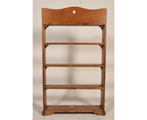 A Victorian 19th century pine Arts &amp; Crafts open window bookcase cabinet. Raised on a plinth base with shaped supports wi