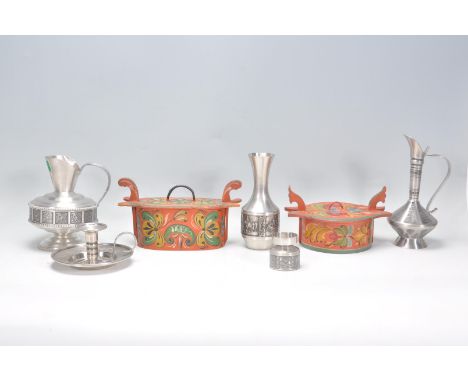 A collection of vintage Norwegian pewter items to include a two jugs, a vase, a chamberstick, and a candlestick holder each h