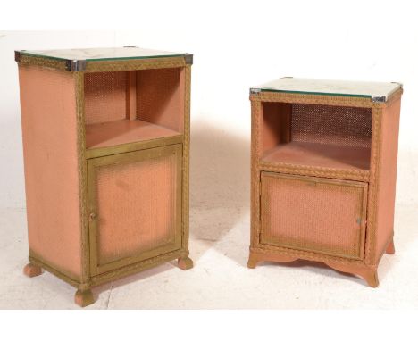 A matched pair of mid century, circa 1950's rattan weave pink Lloyd Loom style linen baskets of typical form together with a 