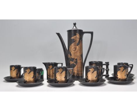 A retro 20th Century Portmeirion coffee service in the Phoenix pattern by John Cuffley, consisting of coffee pot, six cups an