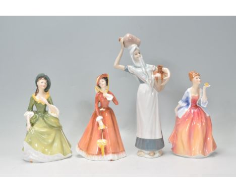 A group of three Royal Doulton ladies to include Julia HN 2705, Fleur HN 2369 and Sandra HN 2401. All marked to the bases. To