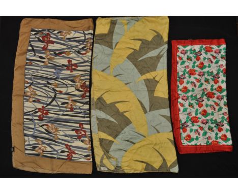 A group of four vintage Liberty printed silk scarves to include an Iris print scarf, a tulip print scarf, a rose print scarf 