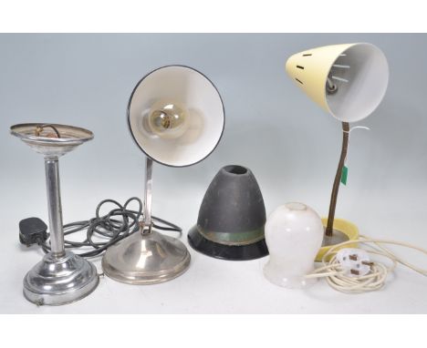 A group of three vintage retro 20th Century table / desk lamps to include a French example having a black conical shade raise