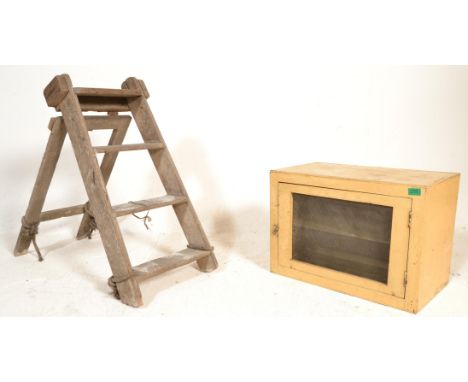A retro mid century, circa 1950's painted pine meat locker with mesh windows together with a small a-frame step ladder of Ind