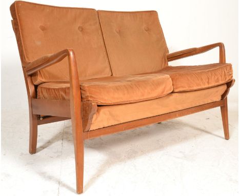 A mid century teak wood Cintique 2 seat sofa settee being raised on a how wood a-frame with upholstered seats and back rests 