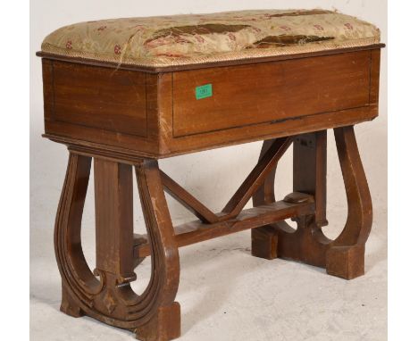 An Edwardian mahogany and ebony line inlaid Queen Anne revival dressing table stool being raised on block feet with squared l