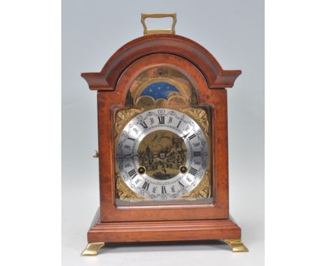 A contemporary&nbsp;bracket clock having a brass face with silver chapter ring having Roman numeral. Face marked St. James wi
