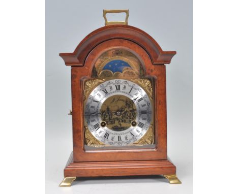 A contemporary&nbsp;bracket clock having a brass face with silver chapter ring having Roman numeral. Face marked St. James wi