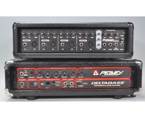 A Peavey Delta Bass Professional Bass Amplifier within a black case. Together with a ProSound 4100 Master Equalization in a b