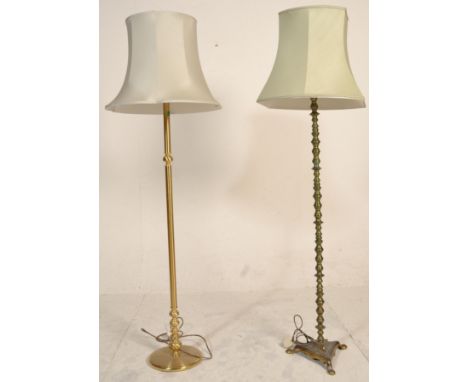 Two 20th Century standard lamps to include a brass knopped column lamp raised on a tripod base with a shade to the top togeth