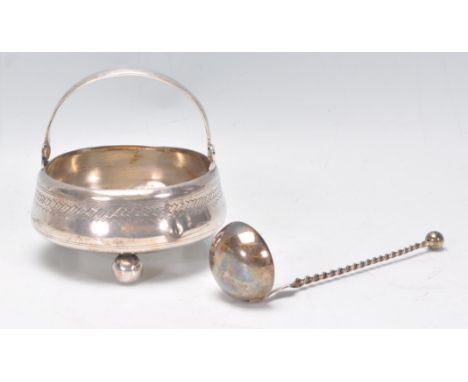 A Russian 84 silver marked Cauldron&nbsp;with bun feet and shaped arched handle. Stamped to the underside for AC&nbsp;1895 Al