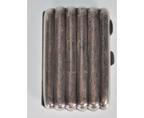 An English hallmarked cigar torpedo cigarette / cheroot case of reeded shaped form having engraved foliate decoration with an