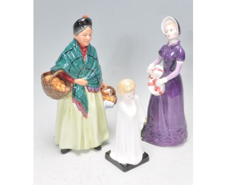 A group of three Royal Doulton ceramic figurines to include&nbsp;The Orange Lady, Good Day Sir H.N. 2896 and Darling H.N. 198