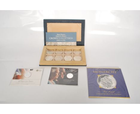 A collection of commemorative coins to include a Royal Mint Historic Crown collection set, a Century of the Monarchy five pou