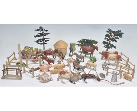 A collection of vintage early 20th century lead and metal worked farm and farmyard toy animal figures to include examples by 