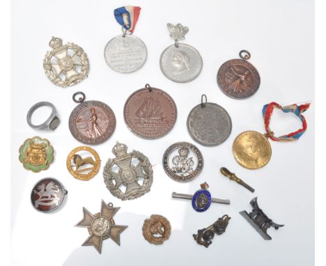 A collection of military medals and enamel badges to include&nbsp;Hallmarked silver tortoiseshell pique military brooch marke