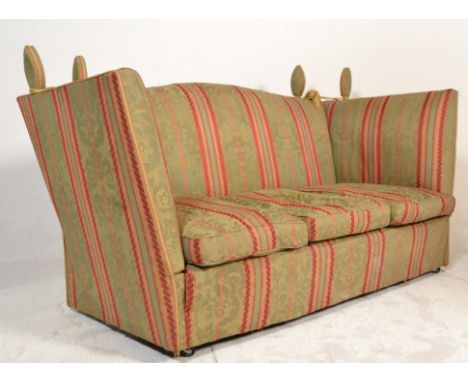 A good mid 20th century knoll sofa settee upholstered in a William Morris inspired fabric with rope and finial tops. All rais