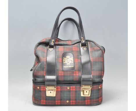 A group of four vintage Almark bowls together within a Dawn DeLuxe bowl bag being tartan print with black leather handles.&nb