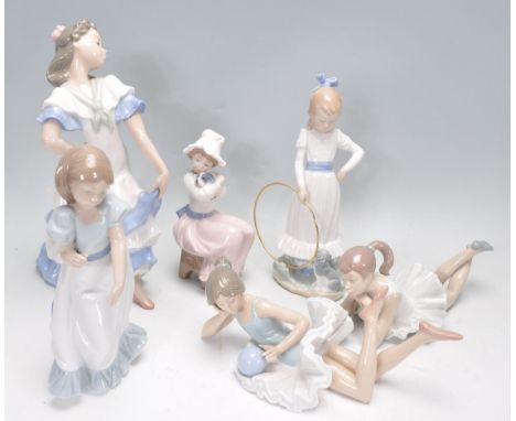 A group of Nao&nbsp;porcelain figurines to include a large&nbsp;flamenco dancer, two ballerinas, 'My dog does tricks' figure,