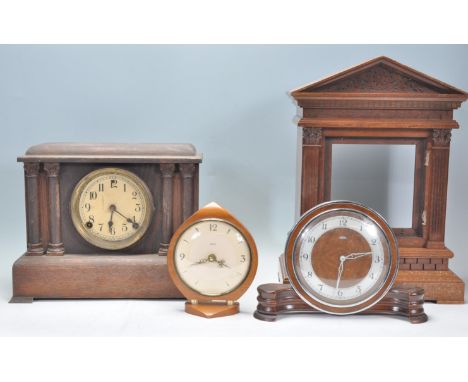 A mixed group of clocks dating from the early 20th Century to include an Art Deco Metamec Dereham walnut cased circular clock