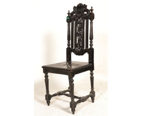 A Victorian 19th century carved oak barleytwist hall chair. Raised on barleytwist legs united by stretchers with carved panel