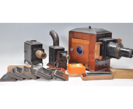 A collection of magic lantern slides and projectors to include two small projectors and one large wooden projector, slides in