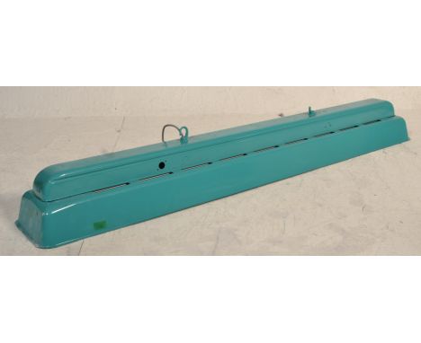 A large metal industrial factory 20th century turquoise colourway rectangular strip light shade having pierced upper section.