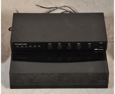 A 20th century Rega Planar 3 record deck with smoked acrylic hood together with a A&amp;R Cambridge A60 Integrated amplifier.