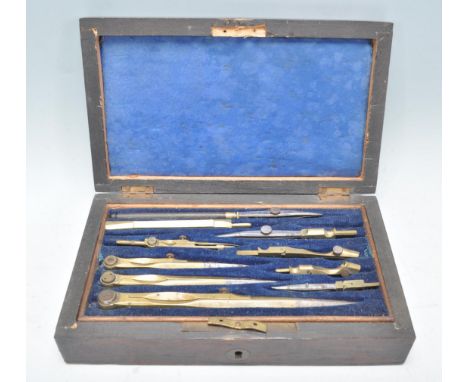 An early 20th Century draughtmans engineering tool box, being dark wood cased with a blue velvet interior being appointed wit