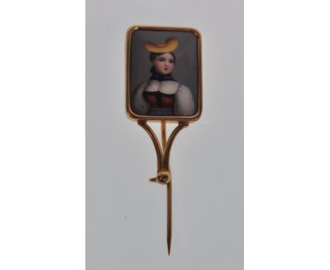 A late 19th / early 20th Century 18ct gold lapel pin having a square panel enamelled with a portrait of a lady wearing a stra